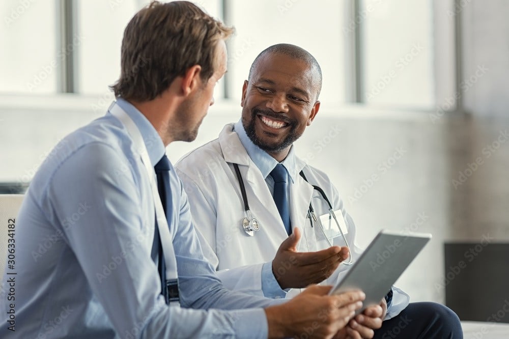 Male patient speaking openly with doctor