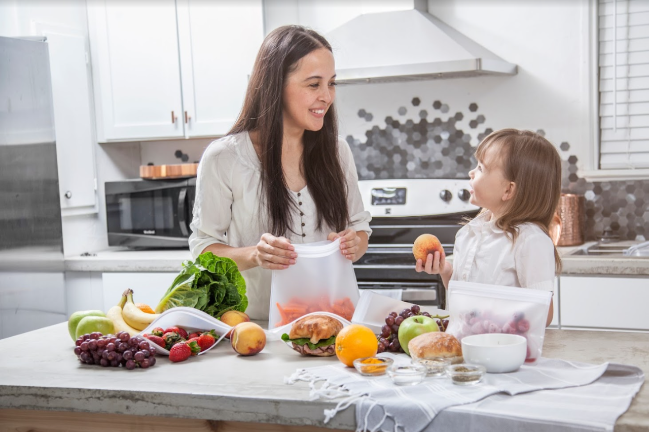 Mother and daughter preparing healthy snacks 