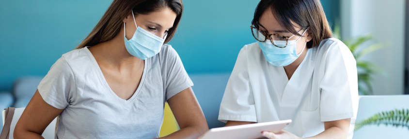 A young woman sits down to talk with her gynecologist, asking questions about period pains and yeast infections.