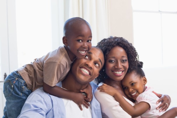 Happy parents and children hugging