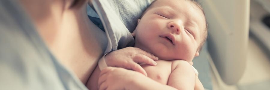 Woman holding newborn baby