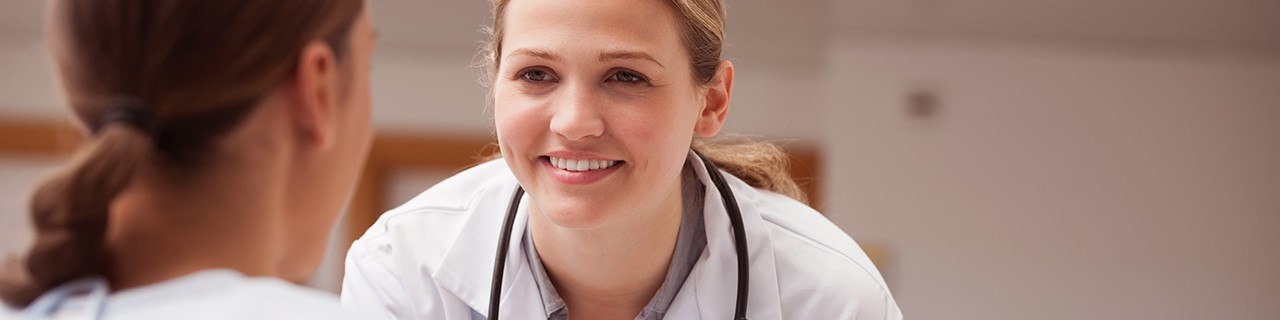 Female breast cancer physician smiling at patient