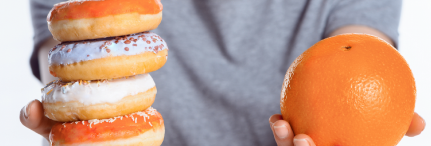 Comparing the health benefits of an orange to several donuts.