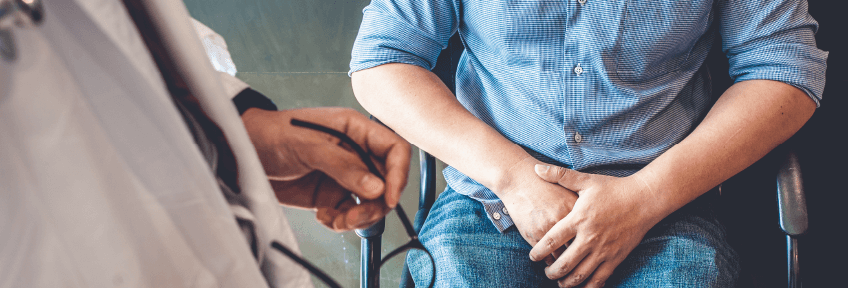 Adult male discusses health concerns like heart conditions and erectile dysfunction with his primary care physician.