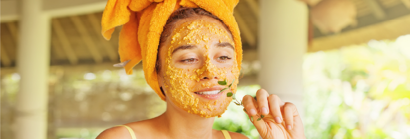 A young woman uses homemade skin care remedies for her skinimalism routine.