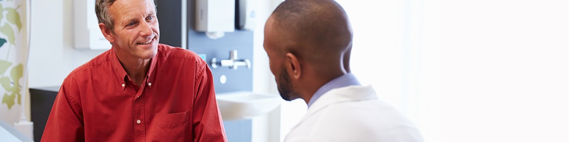 Male patient speaking with his physician