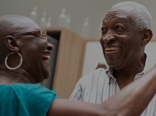Older couple dancing together