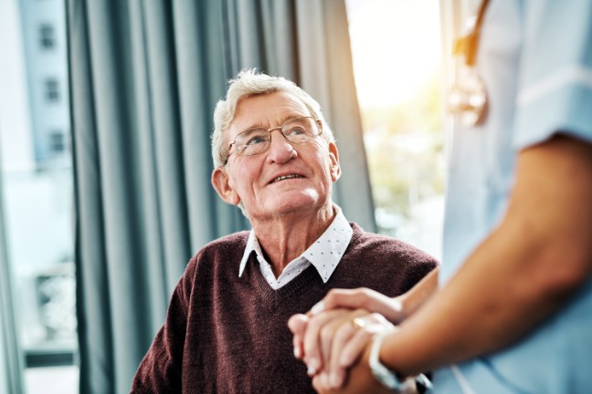 Older man with doctor