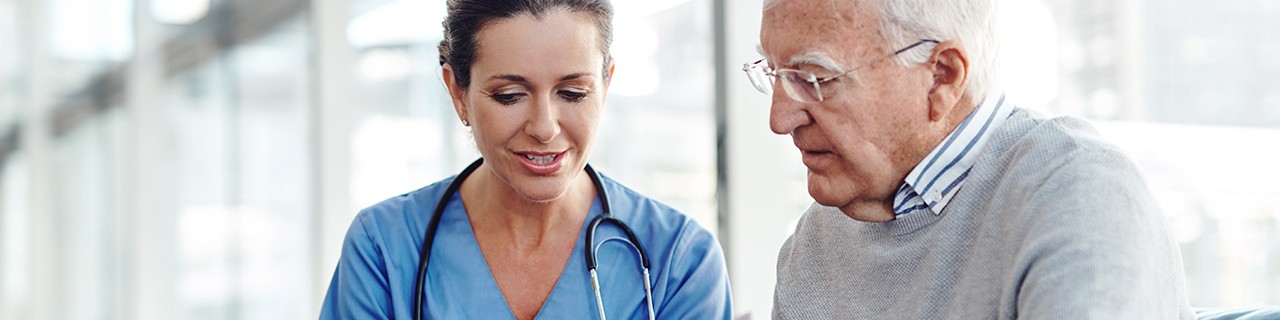 Female physician talking with her male patient