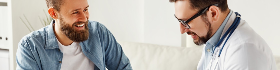 Male patient speaking with his male physician