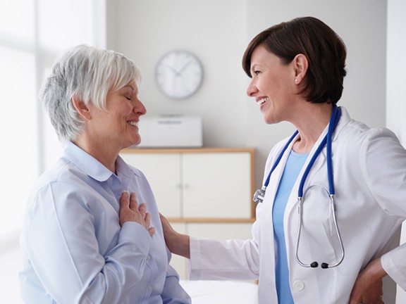 Woman speaking with doctor at appointment