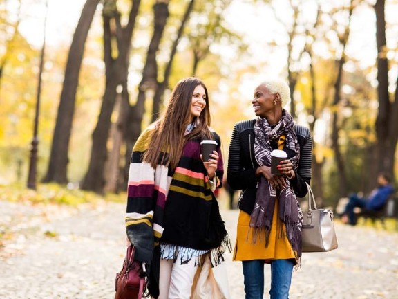 Two women talking outside