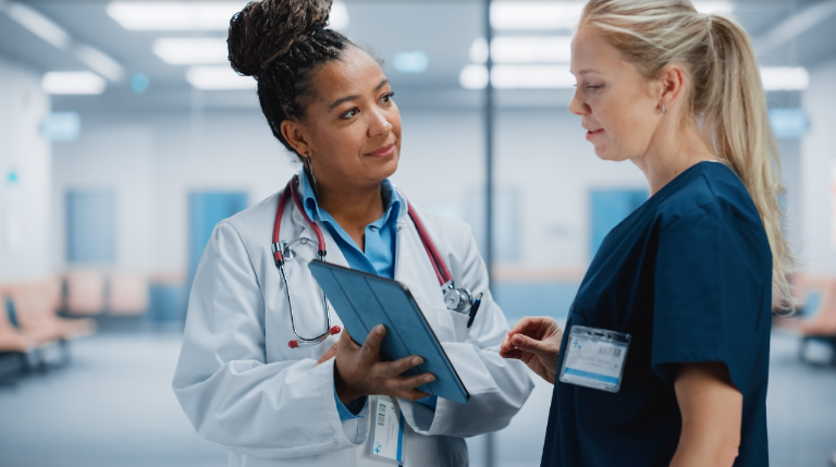 nurse and physician talking