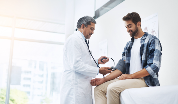 male patient speaking with physician