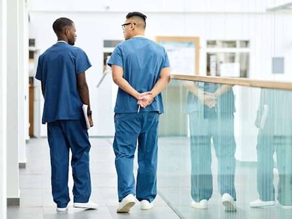 Healthcare professionals walking in hallway