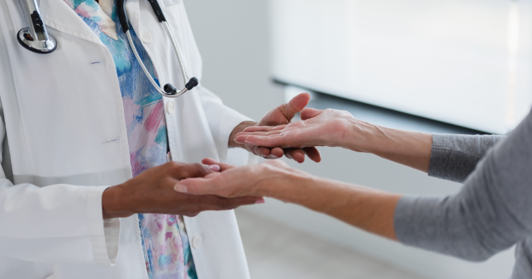 An occupational therapist helps a stroke patient balance as part of rehabilitation.