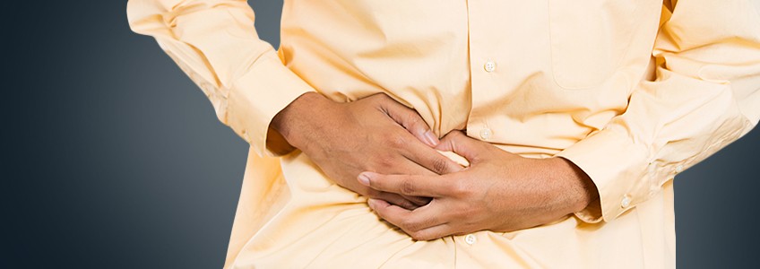 Person clutches abdomen in pain 