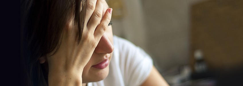 Woman experiencing head pain