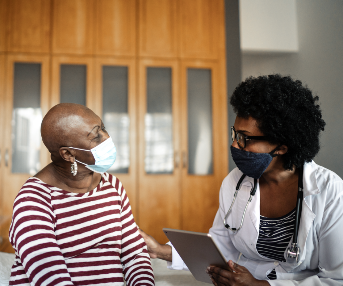 A cancer patient and her oncologist discuss the next steps in her treatment plan.