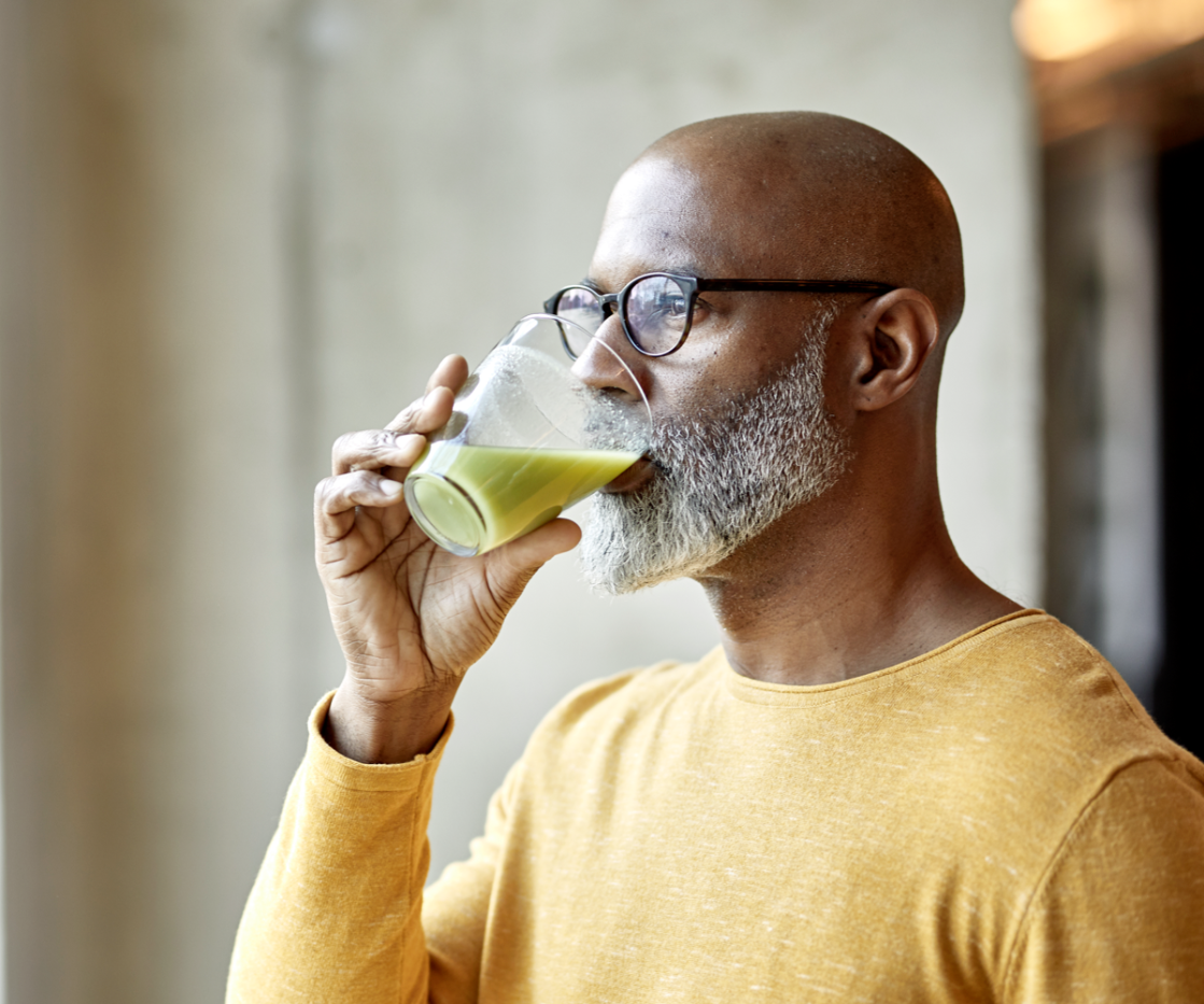 man drinking healthy smoothie