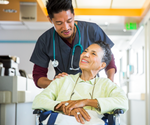 A male nurse escorts a female patient to her room as she recovers from receiving her transplant.