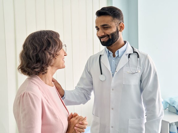 Oncologist speaking with patient