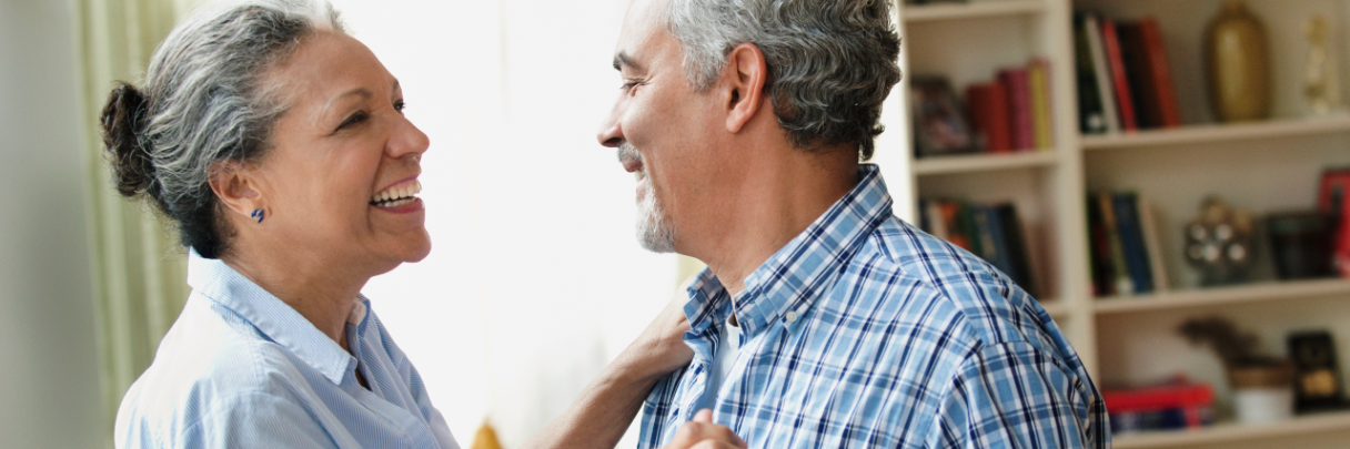 A man dances with his spouse in their home after receiving good news from his endocrinologist.