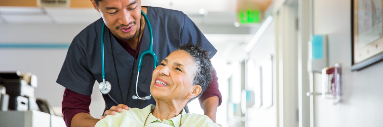 A male nurse escorts a female patient to her room as she recovers from receiving her transplant.