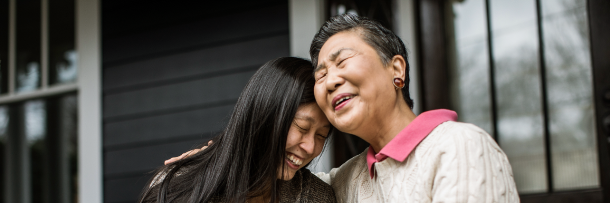 Postnatal doctor visits: benefits and scheduling A senior woman and her adult child sit on the porch and laugh together.