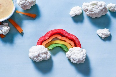 5 Sneaky Ways to Get Your Kids to Eat Their Veggies | St. Luke's Health Bell pepper slices and cauliflower florets make a rainbow.