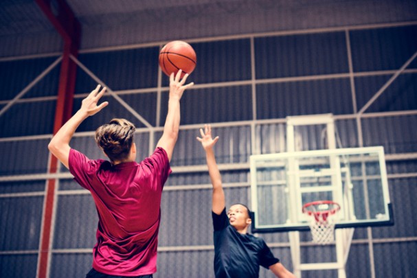 Young at Heart: Why Teen Athletes Experience Cardiac Arrest | St. Luke's Health Two teenage boys play basketball on an indoor court