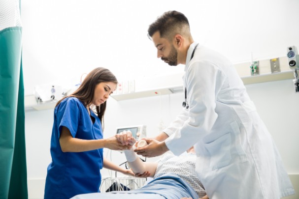 Doctors treat a patient's hurt wrist in the emergency room 