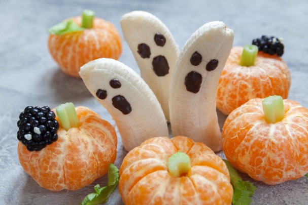 Halloween-themed snacks sit on a table. 
