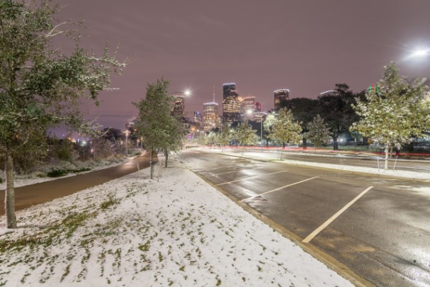 Snowy roads in Houston, Texas, on a dark night