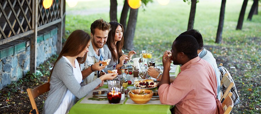 People sharing a meal, making sure they're prepared for an emergency.