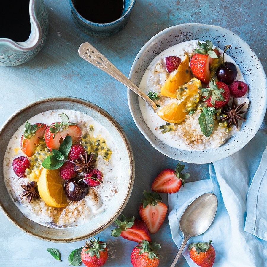 Two bowls of healthy, fresh cooked food.